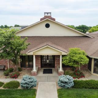 A beautiful residential house with a welcoming front entrance and well-maintained landscaping.