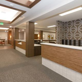 Modern office reception area with stylish interior design and lighting.