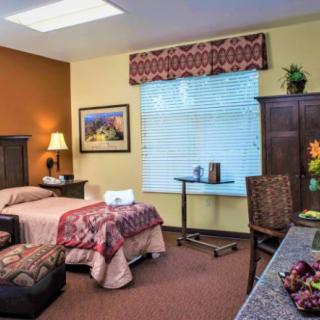A cozy bedroom with warm colors and stylish decor.