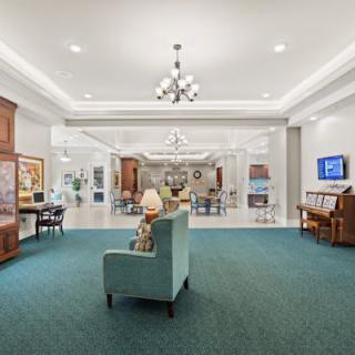 A luxurious lobby with elegant lighting, comfortable seating, and tasteful decor.