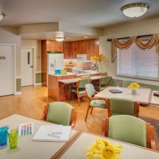 A cozy kitchen and dining area with wooden furniture and cheerful decor.