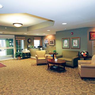 A cozy lobby area with comfortable seating and soft lighting.