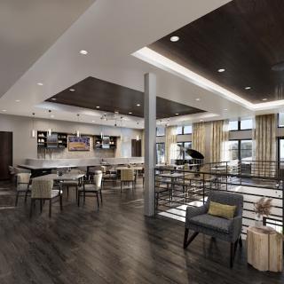 A contemporary lounge area featuring stylish seating arrangements and a well-designed bar.