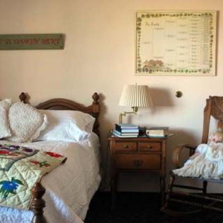 A cozy vintage bedroom with classic furniture and decor.