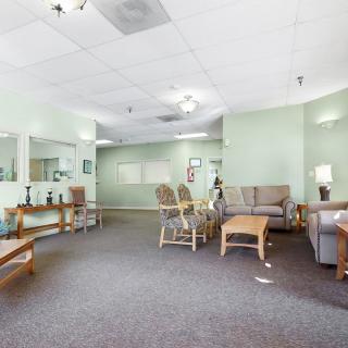 A spacious waiting room with comfortable seating and neutral decor.