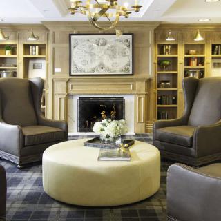 Elegant living room with a central fireplace and comfortable seating.