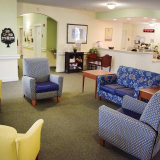 A cozy waiting area with various chairs and a sofa.