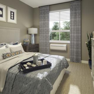 A modern bedroom with stylish decor and a cozy ambiance.