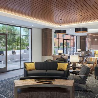 A modern hotel lobby featuring stylish seating and elegant lighting.