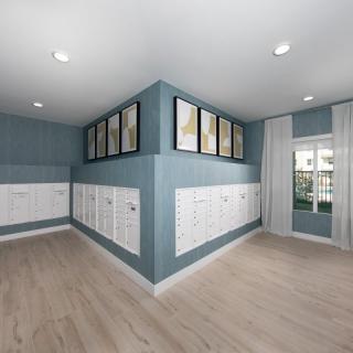 A modern interior room with blue walls, white lockers, wood flooring, and framed paintings above the lockers.