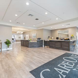 A spacious and modern lobby area with a welcoming reception desk.