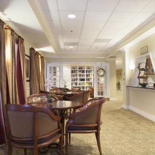 A cozy lounge area with elegant furniture and ambient lighting.