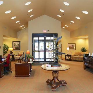A spacious and well-lit lobby with comfortable seating and decorative furnishings.