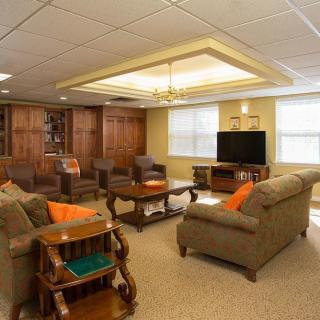A cozy living room with comfortable sofas, a television, and stylish decor.