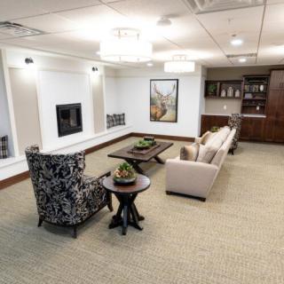A modern living room with comfortable seating and elegant decor.