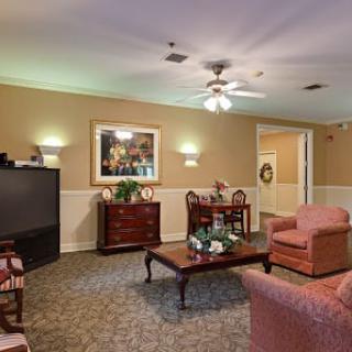 A cozy living room with comfortable seating and soft lighting.