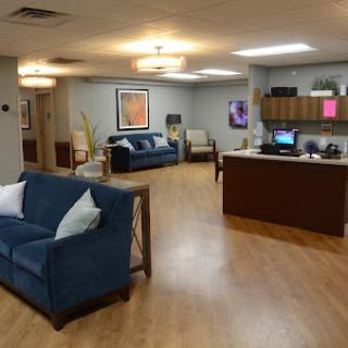 A modern waiting room featuring comfortable seating and a welcoming atmosphere.