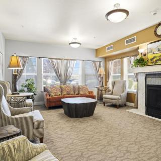 A cozy living room with comfortable seating and a fireplace.