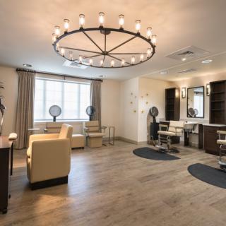 A modern and luxurious salon interior with stylish lighting.
