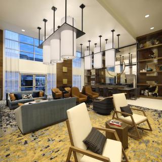 A modern living room with elegant lighting and comfortable seating.