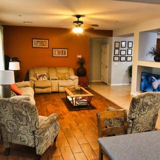 A cozy living room with comfortable seating and warm decor.