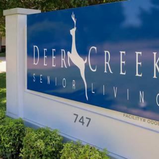 Sign for Deer Creek Senior Living facility.