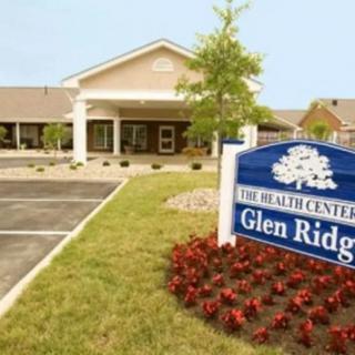 A view of The Health Center at Glen Ridge with a parking area and landscaped entrance.