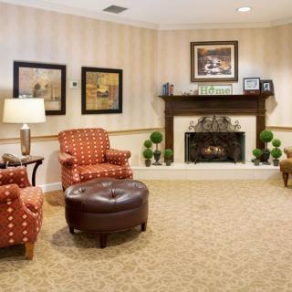 Cozy living room with armchairs and a fireplace.