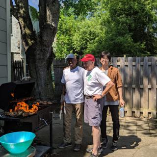 Enjoying a sunny day with friends at a barbecue.