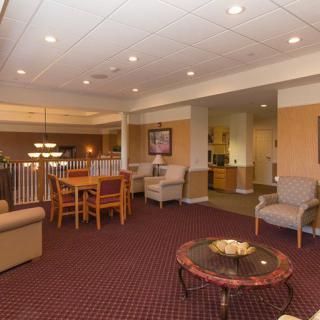 A cozy lobby area featuring comfortable seating and warm lighting.