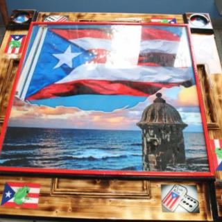 A vibrant artwork depicting the Puerto Rican flag over a coastal landscape with iconic architecture.
