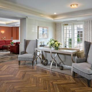 A stylish living room with elegant furniture and decorative elements.