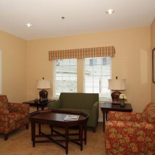 A cozy living room with stylish furniture and warm lighting.