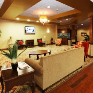 A luxurious lobby with elegant furniture and a chandelier.