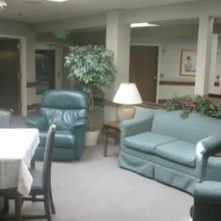 A cozy lounge area with comfortable seating and a table.
