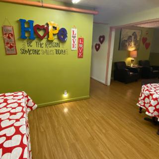 A vibrant interior space decorated with heart-themed elements, creating a warm and inviting atmosphere.