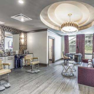 A modern and stylish salon interior with chic furniture and lighting.
