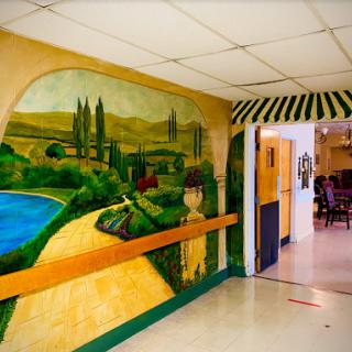 A beautifully painted mural depicting a serene landscape, enhancing the ambiance of the hallway.