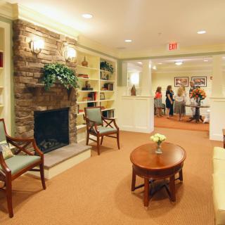A cozy lobby featuring a fireplace and comfortable seating.