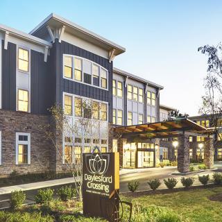 A modern residential building with a well-landscaped exterior.