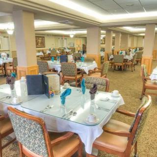 Spacious dining area with neatly arranged tables and chairs.