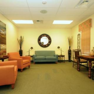 A cozy waiting room with comfortable seating and stylish decor.