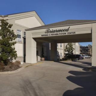 Entrance to a healthcare building with a covered driveway.
