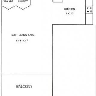 Studio apartment floor plan with kitchen, living area, closets, and balcony.