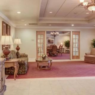 A warmly lit lobby area with comfortable seating and elegant decor.