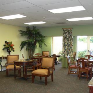 A cozy living area featuring comfortable seating, vibrant colors, and plenty of natural light.