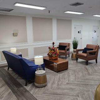 A cozy lounge area featuring modern furniture and a welcoming atmosphere.