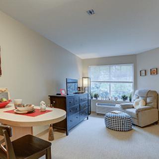 A cozy living room with comfortable seating and natural light.