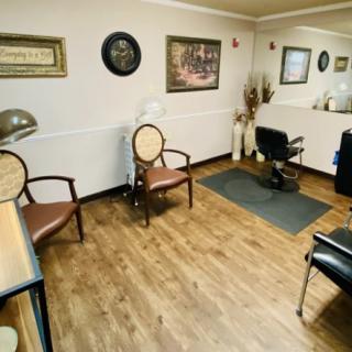 A cozy waiting area with wooden floors and elegant decor.