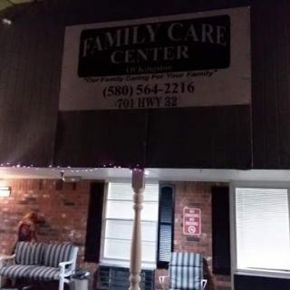 Exterior view of the Family Care Center, showcasing its signage at night.